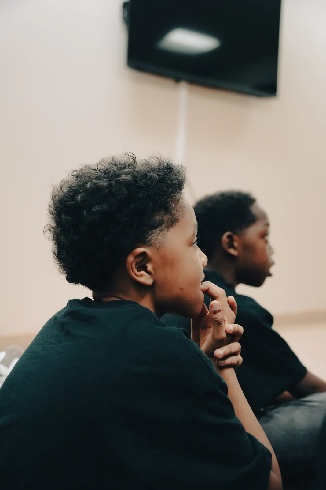 A boy listening closely during a KHA workshop at the clinic