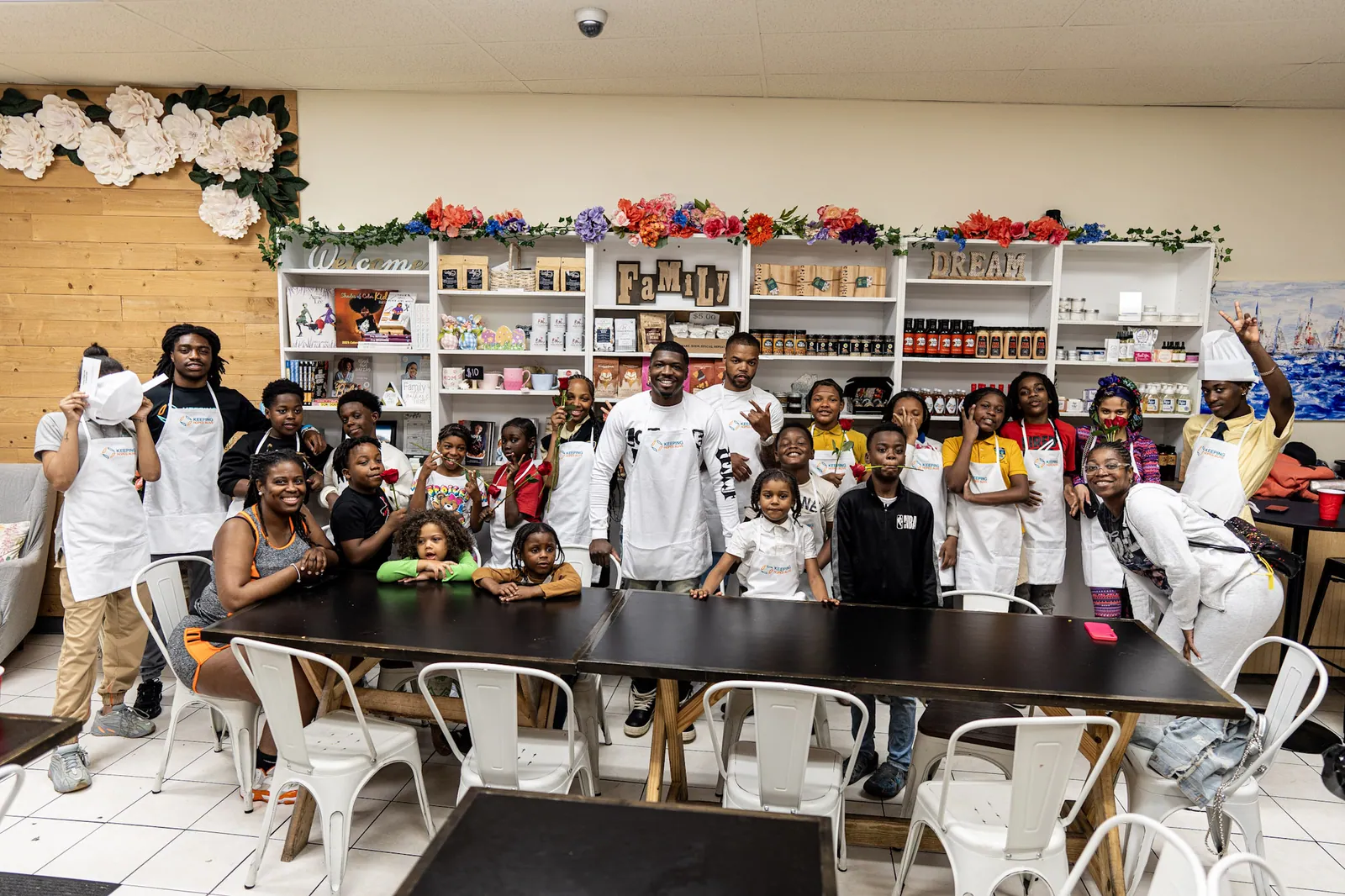 Adults and young people together in the kitchen after a KHA cooking class