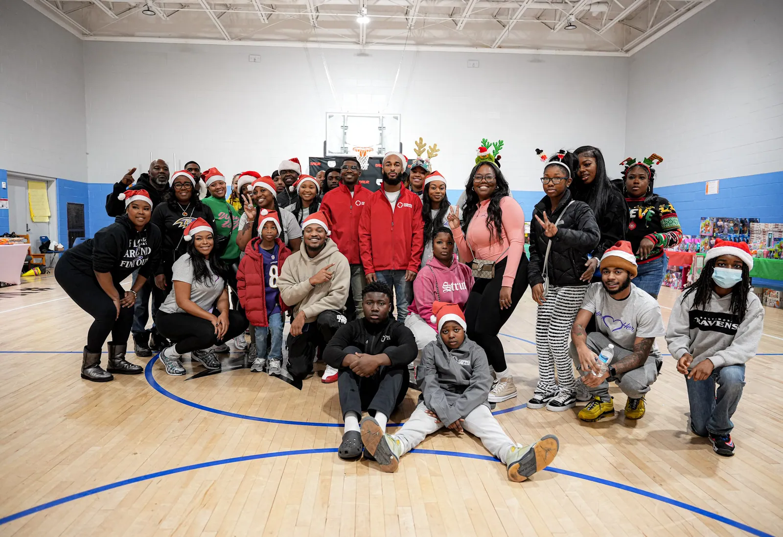 Families and KHA staff gathered in the gym at the holiday giveaway