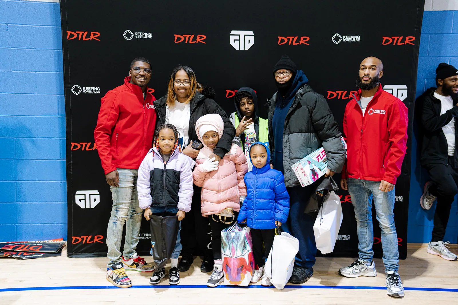 KHA staff and children at the toy giveaway with community partners