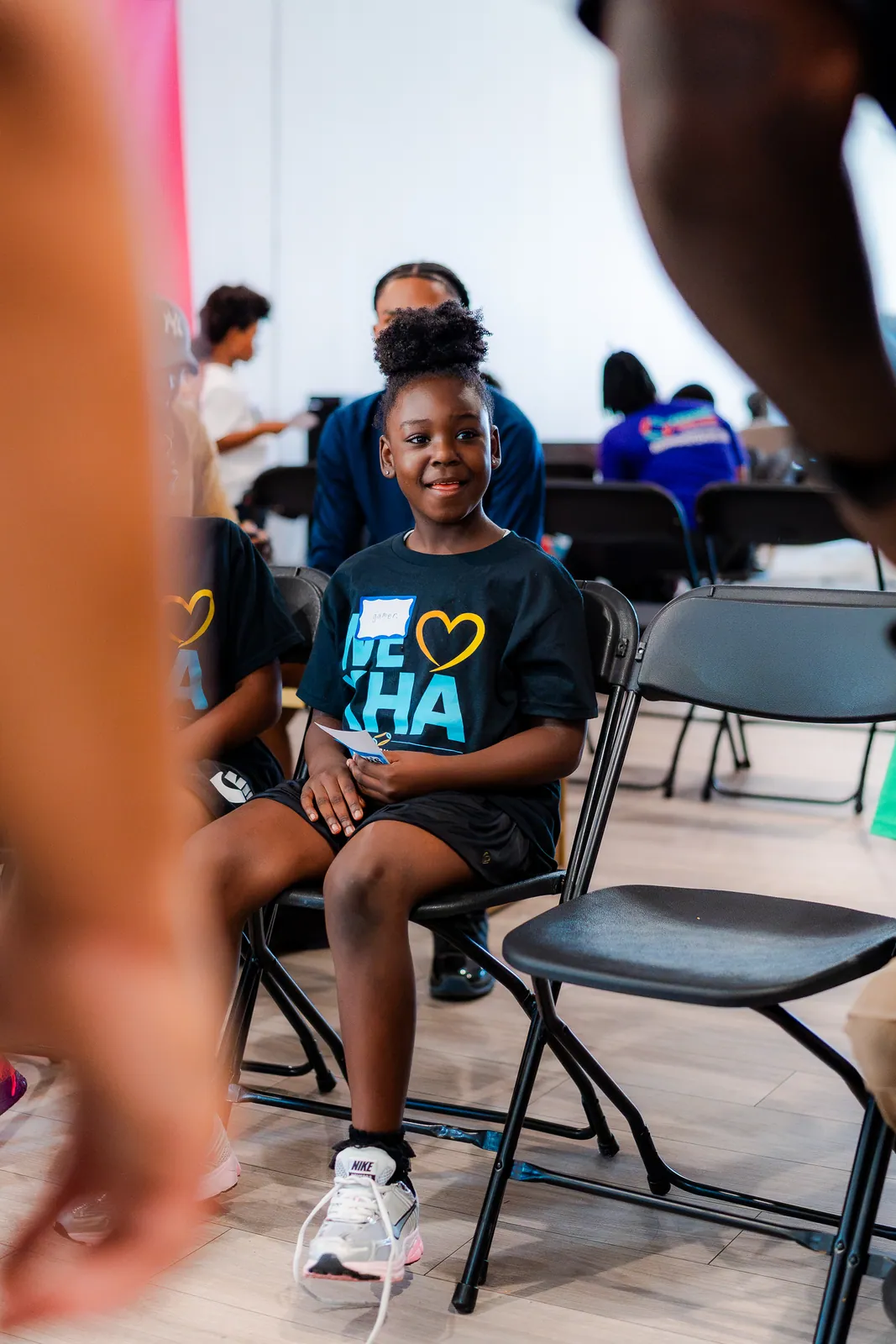 A young participant seated during a DGTL University session