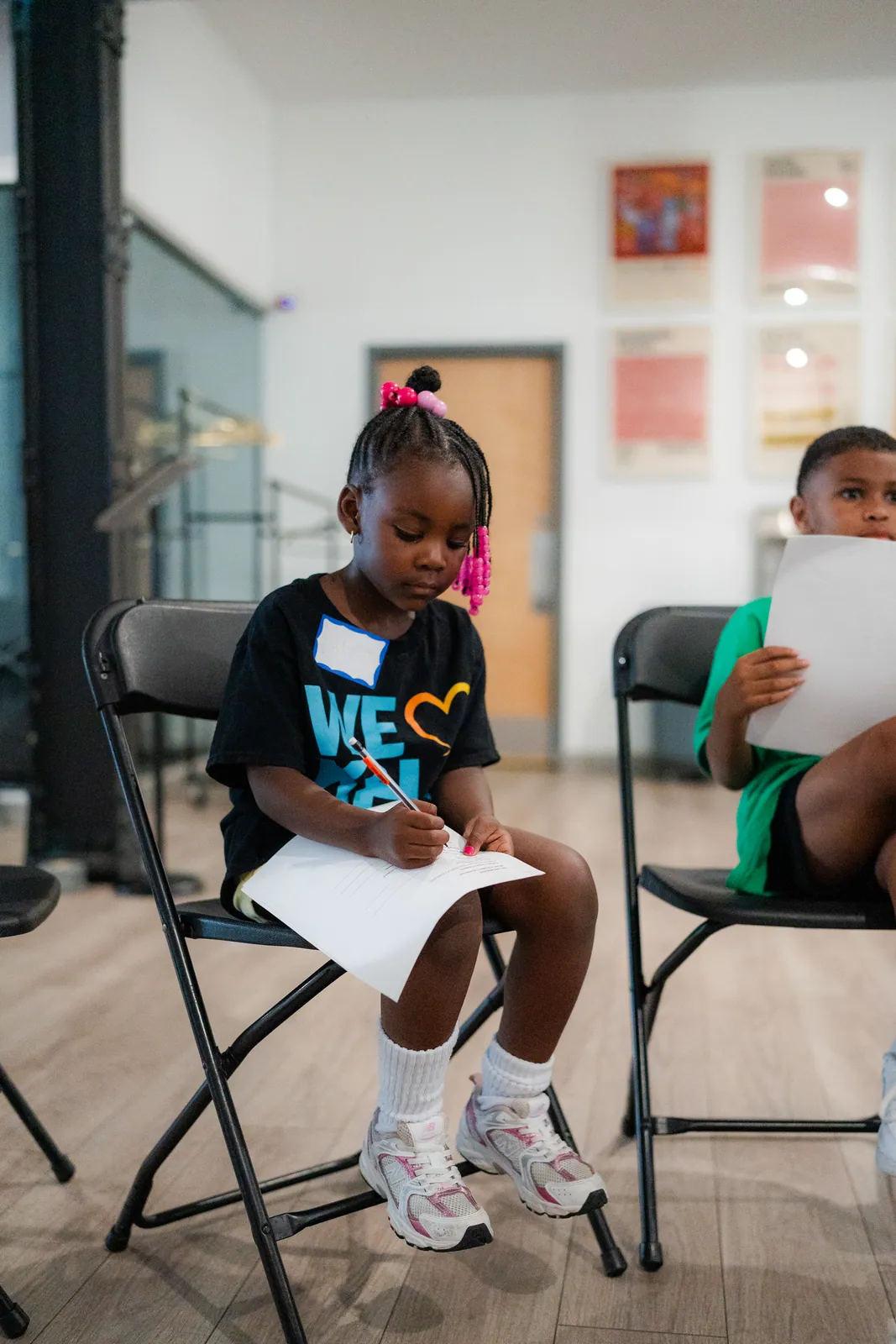 A girl taking notes during a KHA workshop