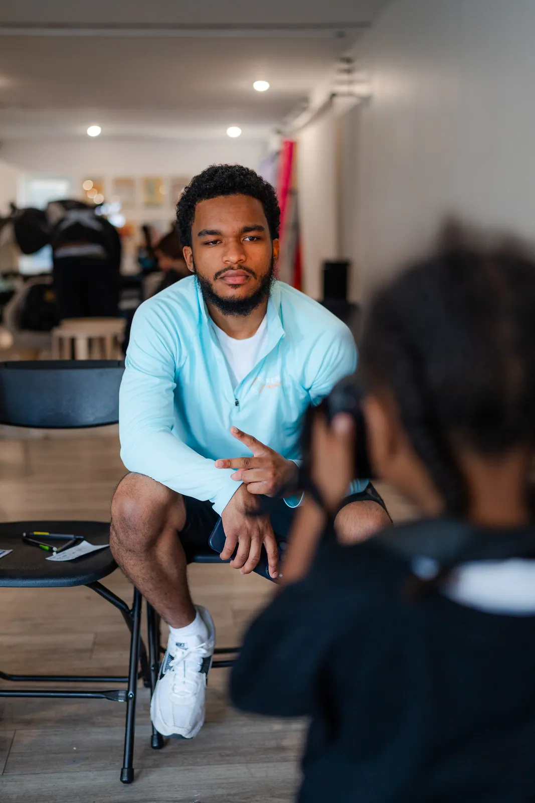 A mentor being photographed by a KHA youth