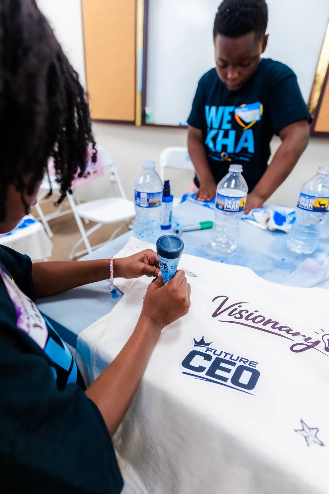 A KHA youth designing a t shirt at the Peace in Printing workshop