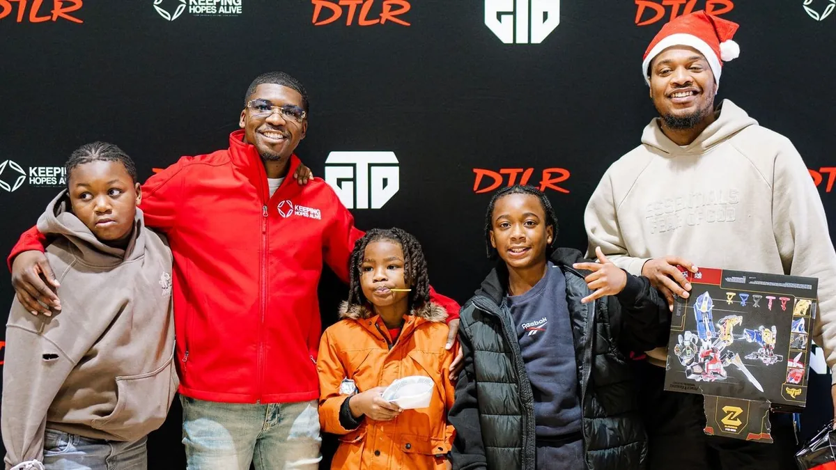 Children with KHA and DTLR staff at the Sandtown Winchester toy drive photo wall